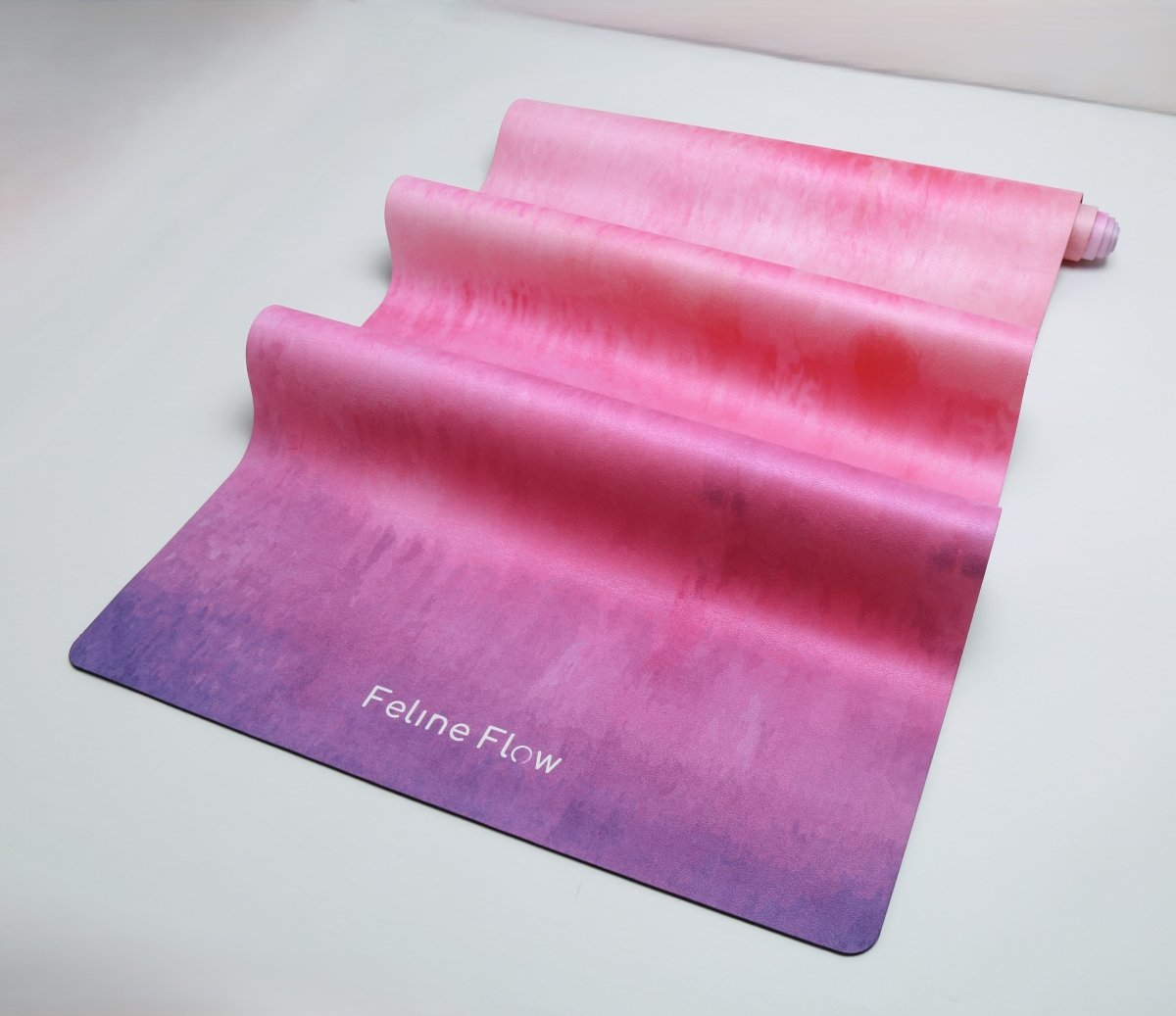 detail of fuchsia yoga mat microfiber surface white background